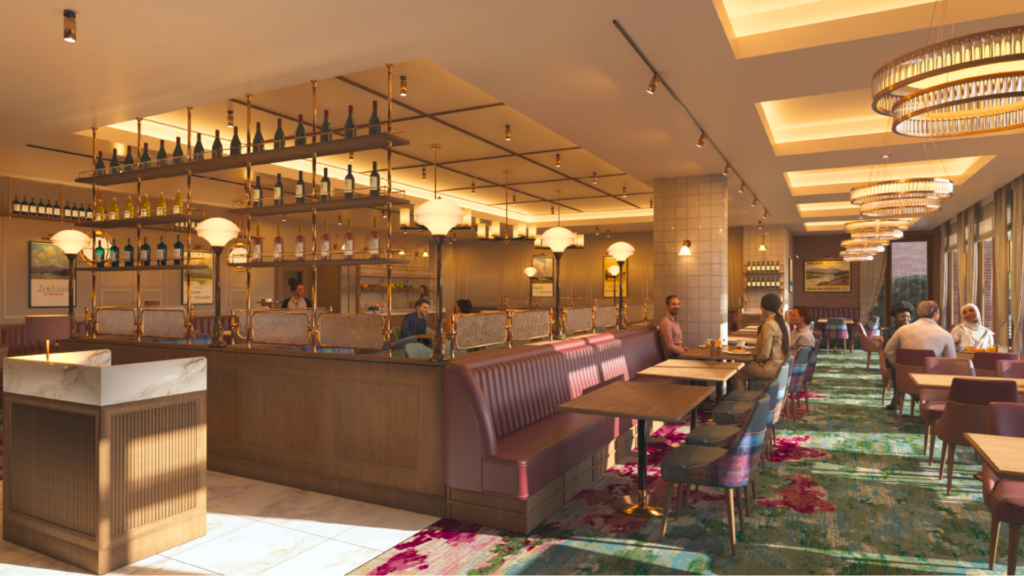 Modern restaurant interior with upholstered seating, decorative lighting, and a central bar area; several people are seated at tables and booths, dining and conversing.