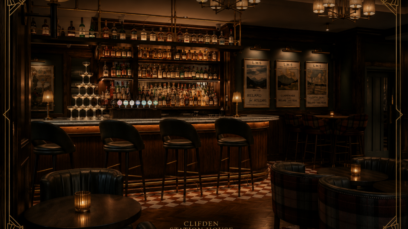 Dimly lit hotel bar with a wooden counter, bar stools, shelves of liquor bottles, a champagne tower, and small candles on tables. Vintage travel posters decorate the back wall.